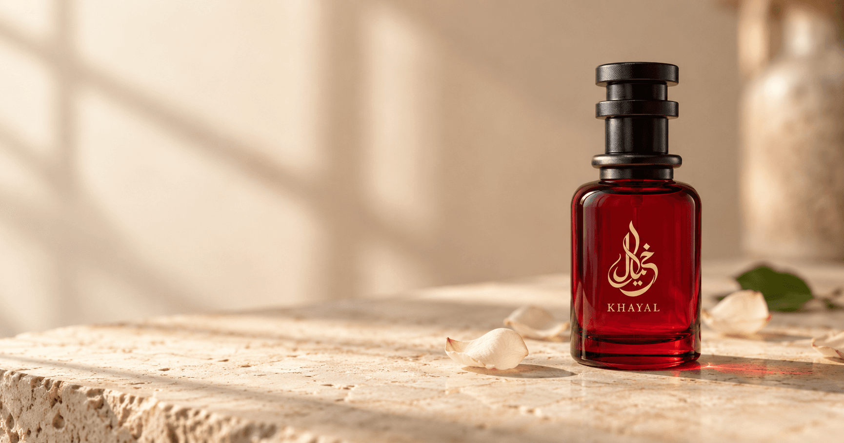 Two perfume bottles arranged with soft floral petals for a fragrance layering guide